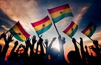 Silhouettes of People Holding Flag of Ghana