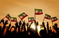 Silhouettes of People Waving the Flag of Iran