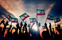 Silhouettes of People Waving the Flag of Iran