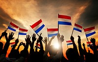 Silhouettes of People Holding Flag of Netherlands