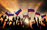 Group of People Waving Russian Flags in Back Lit