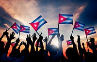 Silhouettes of People Holding Flag of Cuba