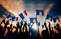 Silhouettes of People Holding the Flag of France