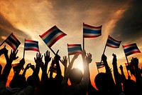 Group of People Waving Flag of Thailalnd in Back Lit