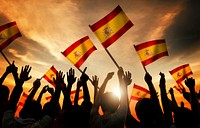 Silhouettes of People Holding Flag of Spain