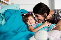 Mother and daughter playing together with happiness