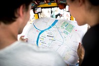 Rear view of people checking using Bangkok Thailand map