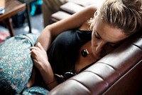 Closeup of a caucasian woman taking a nap on the couch