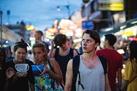 A group of tourist enjoying bucket drinks in Khao San Road, Bangkok, Thailand 