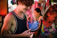 A tourist enjoying bucket drink in Khao San Road , Bangkok, Thailand 