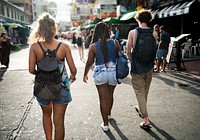 Rear view of walking tourists