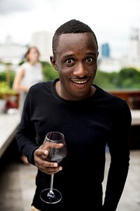 Guy making a funny face while drinking wine