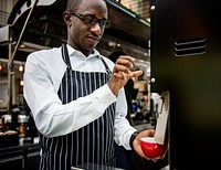 A barista preparing a cup of coffee