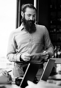 Guy with a long beard reading presentation cue cards