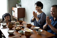 Japanese family praying together