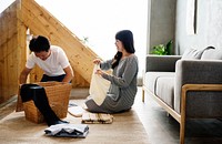 Japanese husband and wife folding clothes together