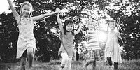 Cute diverse kids playing in the park