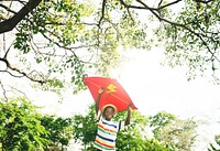 Little Boy Flying Kite Playing Cheerful Activity Concept