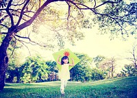 Cheerful Child Playing Kite Outdoors