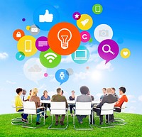 Group of Multi-Ethnic People in a Meeting and Social Networking Related Symbols Above