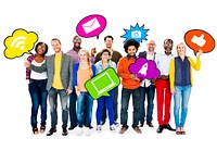 Group of friends holding speech bubbles containing images with social networking theme.