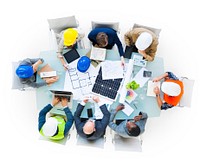 Group Of Construction Site Workers On A Conference Table Holding A Meeting