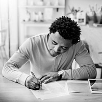 African Man Writing Planning Strategy Goal Target Business Concept