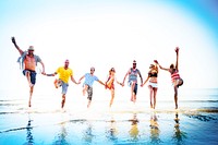 Friends playing in the water at the beach