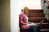 African woman working on a laptop