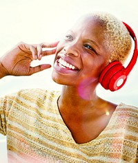 African Woman Headphones Listening Music Concept