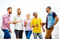 Group of friends hanging out at the beach