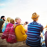 Group Of People Sitting On the Beach Concept