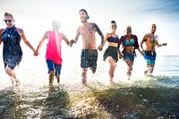 Friends running in the water