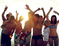 A group of diverse people is having fun at the beach