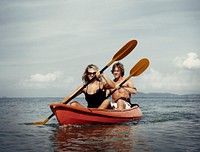 A caucasian couple is kayaking