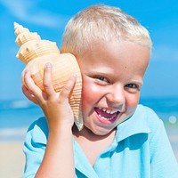 Little boy having fun on a beach Concept
