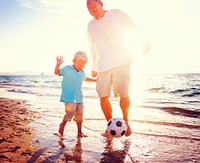Father Son Playing Soccer Beach Summer Concept