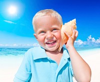 Little boy having fun on a beach.