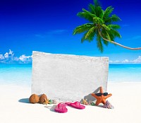 White Wooden Board with other Objects on the Beach