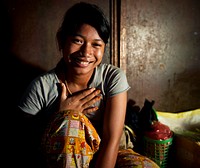 Teenage girl smiling at the camera.