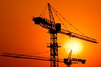 Construction of a major housing project at sunset.