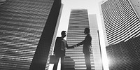 Businessmen Cityscape Handshake Partnership Concept