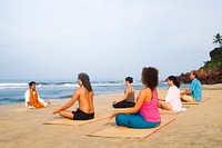 Yoga class by the beach