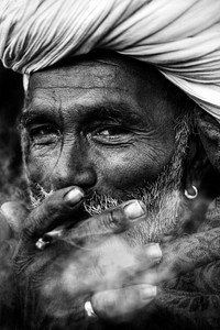 Portrait of an Indian man smoking