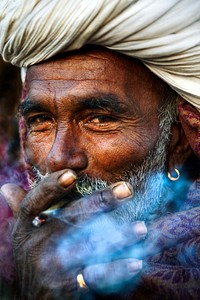 Indian man smoking happily