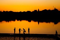 Indian boys washing up by the lake