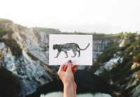 Female Holding Stencil Outdoors with the Sign