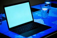 Laptop on a digital desk cyber space