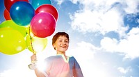 Happy Boy Outdoors Dozen Helium Balloons Playful Concept