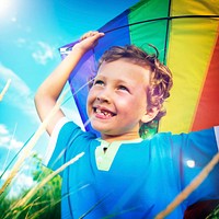 Cheerful Young Boy Playing Kite Outdoors Concept